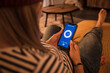 © Westend61 - Young woman operating home automation app on smart phone