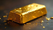 © freedarts - Close-up of a shiny gold bar on a dark background. Scratches and chips on its surface and gold flakes add rich texture.