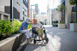 © Halfpoint - Senior patient in wheelchair talking with her caregiver.