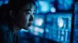 © DEIB Visuals - Asian Woman Cybersecurity Analyst Working in Secure Operations Center