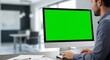 © Studio VIP - Creative male designer working at desktop monitor with vivid green screen, stylish studio background, lifestyle workspace photography for digital design mockups