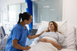 © ReeldealHD images - Nurse and patient interaction in a hospital room