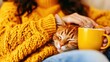© Wanruedee - Cozy Autumn Afternoon with Cat and Mug in Warm Sweater