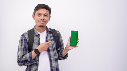 Asian Man Holding SmartPhone In Hand Showing green Screen To Camera Pointing At You, Happy Millennial Guy Recommending New Application Or Mobile Website, Mockup Banner Collage