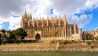 © Adobe - Grand cathedral by a river