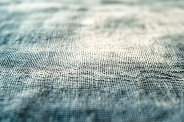 Close-up view of a textured fabric surface, showing intricate woven details and subtle color variations.