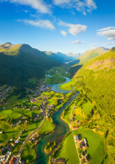 Wall Mural - Nature in fjords. Traveling through the Norwegian fjords. Stryn, Norway. River in a mountain valley. Scandinavia. View of nature from the drone. Background, wallpaper, postcards.