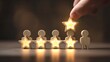 © ali - Elevating Excellence Hand Places a Glowing Star atop Wood Figures Symbolizing Outstanding Ratings against a Soft Warm