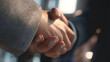 © Norman - Handshake deal : A close-up shot captures the pivotal moment of a business agreement, two people shake hands, signifying partnership and mutual respect. Symbolizing trust, and sealed with a firm grip
