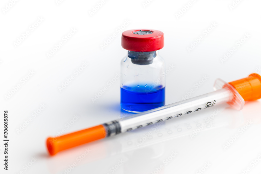 Insulin Injection Blue Close up of Blue Vial with Peptide Blend Next to Insulin Syringe (KLOW ...