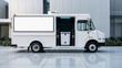 © Mariana Rusanovschi - White food truck with open service window and blank menu board parked on concrete