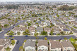 Carson, Los Angeles LA County, CA, California, May 9, 2024: Aerial Drone City View toward Townhouses, California State University,  Houses, Streets
