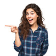 © Аrtranq - Excited woman points to the left with surprised expression