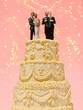 © French Anderson Ltd/Stocksy - Wedding cake with LGBTQ and heterosexual couples against pink