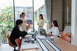 © Wanchai - Executives listening to a marketing strategy presentation.