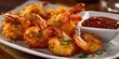 © Soba - Crispy coconut shrimp with tangy dipping sauce garnished with fresh herbs