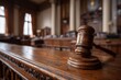 © dmmarychev - Wooden gavel resting on a courtroom bench in a formal judicial setting