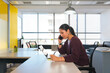 © Dani Nahuel/Stocksy - Focused Businesswoman on a Call