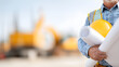 © Alexey - Caucasian man holding hard hat and blueprint. Construction worker at building site, engineer planning project detail. Copy space design.