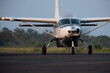 © Nicholas Matev/Stocksy - Small Commuter Turboprop Aircraft on Runway Front View