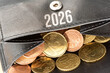 © studio v-zwoelf - A wallet, euro banknotes and coins, and the year 2026
