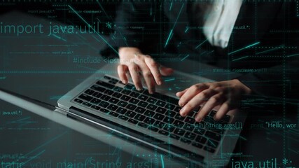 Close-up of a programmer hands typing on a laptop keyboard. The image showcases digital data streams, representing modern software development and technology innovation. Xenic