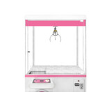 Close up empty large white claw machine decorated with pastel pink isolated