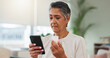 © peopleimages.com - Phone, senior woman and search pills in home for medication benefits, ingredients or side effects. Old person, mobile app or reading tablet label in house for dosage instruction or pharmaceutical FAQ