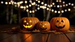 © siripon - Festive Halloween Night with Three Intricately Carved Pumpkins Illuminated by Glowing Lights Creating a Spooky and Enchanting Atmosphere Outdoors