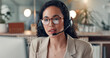 © peopleimages.com - Business woman, night and consultant with headset in office for customer service or online advice. Female person, agent or working late with glasses or mic for virtual assistance or communication