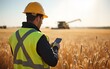 © li - Technician in a wheat field. High quality