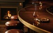 © Sweet heart - Stylized upscale bar interior featuring amber liquor, brass-trimmed counter, cigar smoke and cozy firelight. Sophisticated illustration for packaging or digital products.