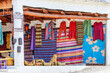 Colorful textiles displayed outside a local market in a village Capileira.