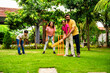 © StockImageFactory - Indian Asian family bonding through outdoor cricket batting in garden, enjoying fun and play