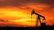 © Disco - A silhouette of an oil well against a vibrant sunset sky, capturing the essence of the industrial landscape.