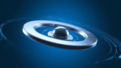Wall Mural - A seamlessly looping video features a sleek silver circular flare with metallic glints orbiting its core, depicting a sophisticated abstract technological interface website, sphere, clean