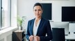 © Graphic Dude - Confident businesswoman in blue suit in modern office