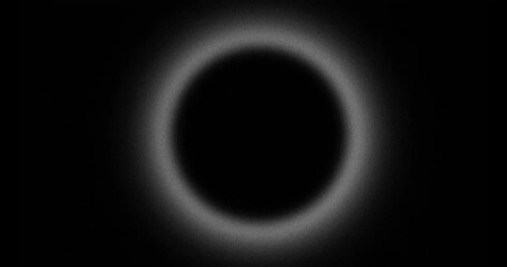 Wall Mural - abstract blurred grainy hole with pulsing halo, looped on black background