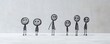 © ivona - Minimalistic stick figures standing apart outdoors.