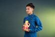© Dip Photography - Happy young man holding and posing with Ganesha statue on the occasion of Ganesh Festival