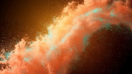 Orange and blue holi powder exploding on black background. Vibrant cloud of color burst for abstract art or party concept video.