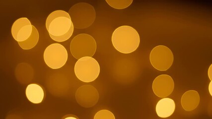 Wall Mural - Abstract golden bokeh orbs gently expanding and shrinking, producing a fluid and seamlessly looping artistic texture organic, abstract golden bokeh orbs, digital
