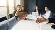 © leonardo - POV: reaching out to shake hands in a business meeting