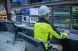 © reewungjunerr - Engineer working at control room, Manager control system, Technician man monitoring program from a lot of monitor.Specialist observes analytics dashboard,operator inspects digital interface