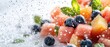© Tetiana - Fresh Fruits with Splashing Water. Watermelon cubes, Blueberries, and Mint. Health and Fitness diet dessert idea.