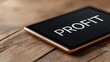 © FocusFusion - Digital Display Shows Profit on Wooden Table