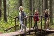 © Viktoriia Kozhevnikova/Stocksy - Three Generations Walking Together in Sunny Forest