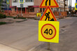 © Alexey Kuzma/Stocksy - Road Construction Signs Indicate Speed Limit in Urban Area
