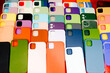 © Adrian Rodd/Stocksy - Close-up shot with flash of several colorful smartphone cases