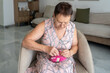 © Inna Reznik/Stocksy - Senior Woman Sewing a Plush Toy in a Cozy Living Room